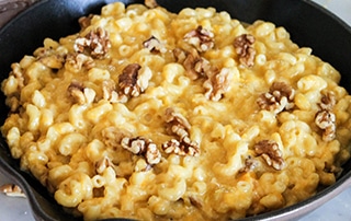 Skillet of Butternut Squash Mac and Cheese with Walnuts.
