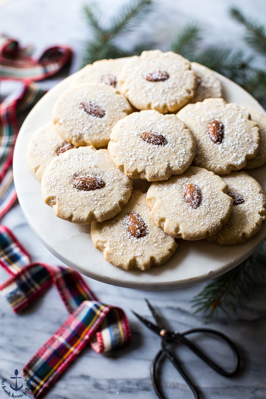 Festively decorated table with plate of Almond Meltaways Cookies.