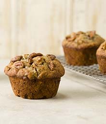 Banana Nut Muffins on counter and cooling rack.