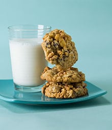 Stack of Chewy Chocolate Chip Walnut Cookies and glass of milk.
