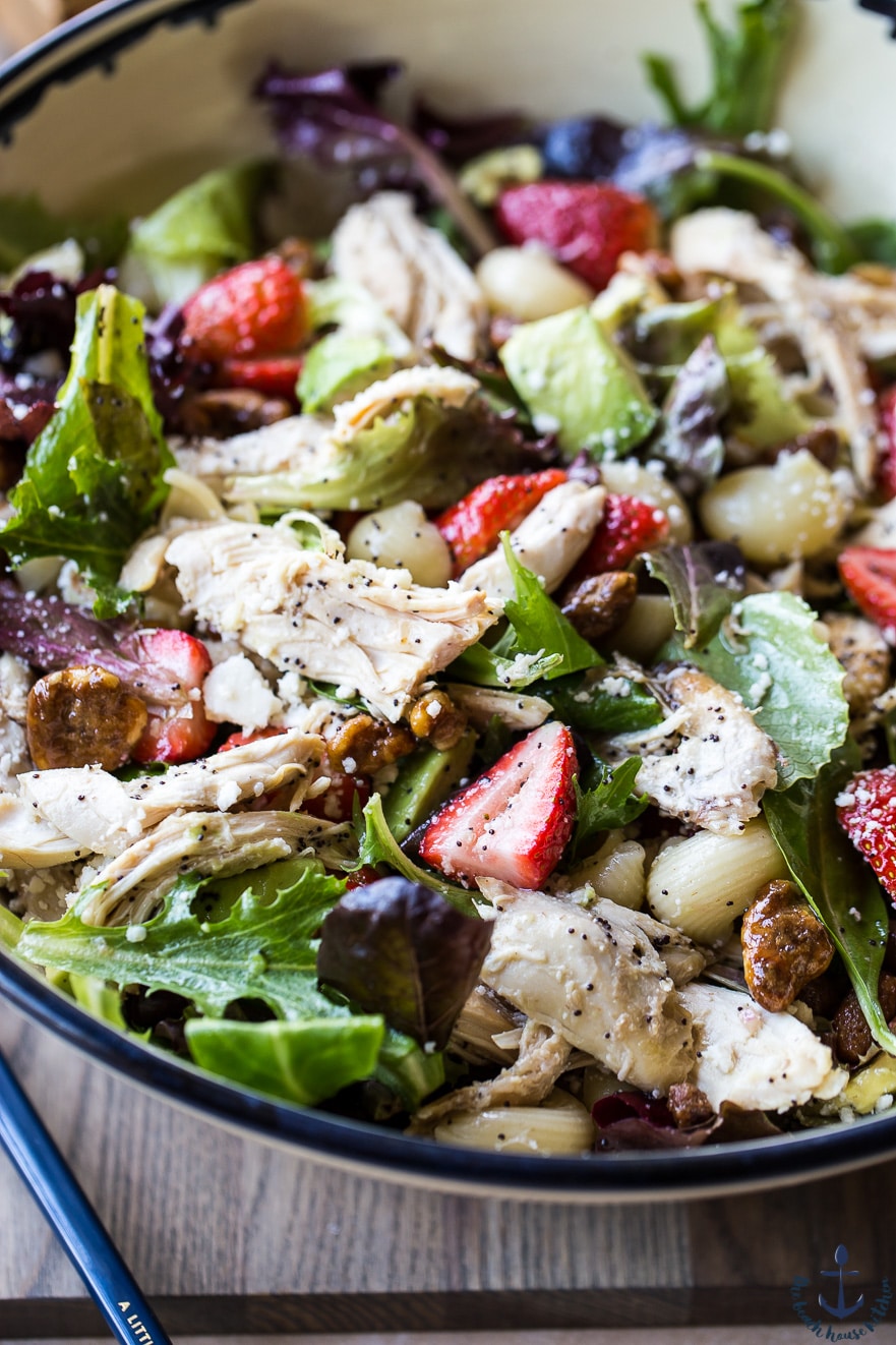 Bowl with Chicken Strawberry Avocado Pasta Salad with Glazed Walnuts and Creamy Poppyseed Dressing.