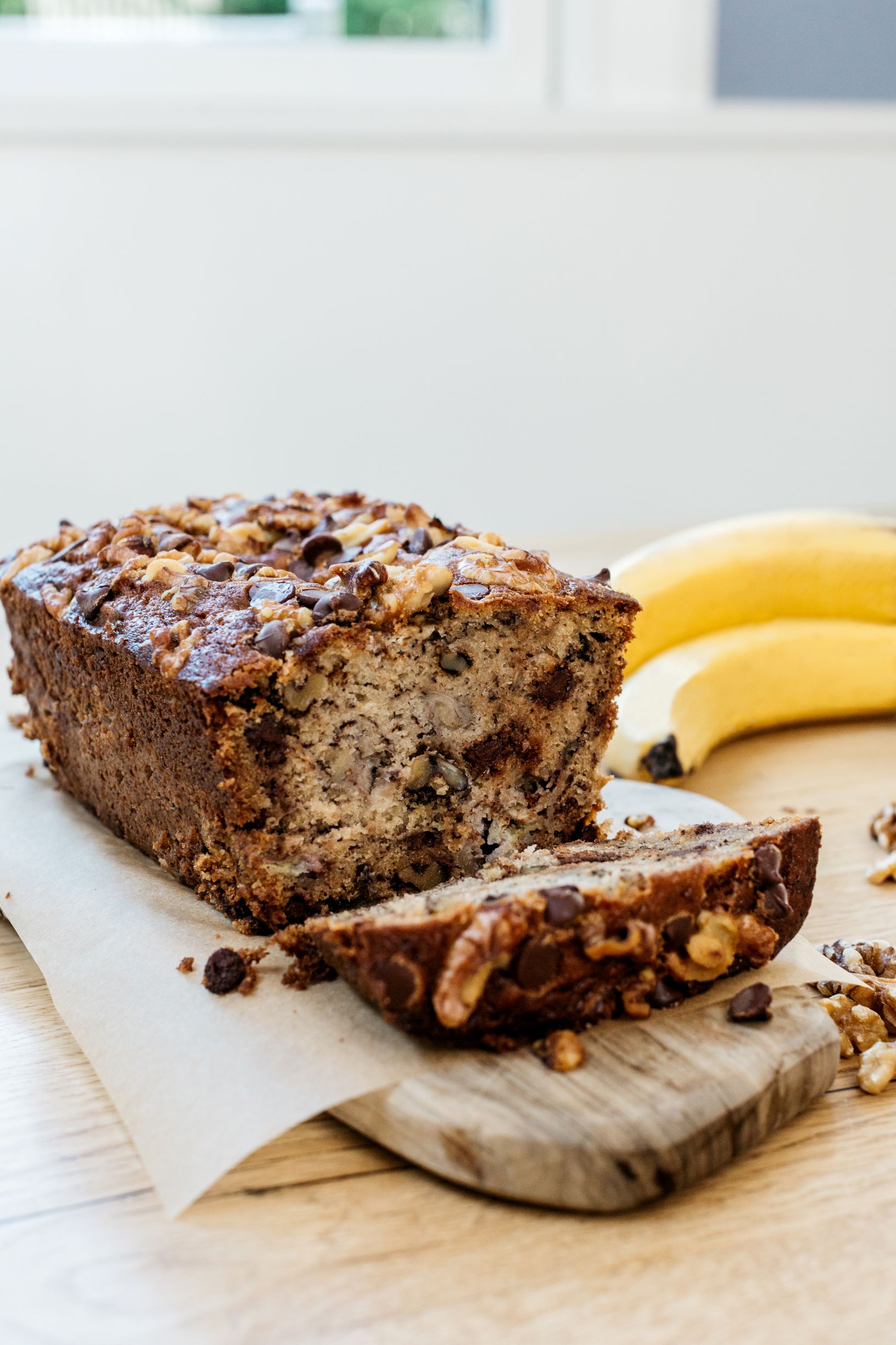 Chocolate Chip Walnut Banana Bread on cutting board.