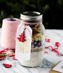 Mason jar gift with layered ingredients for Cooking for Keeps' White Chocolate Cookies.