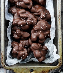 Pan filled with Almond Clusters topped with salt crystals.