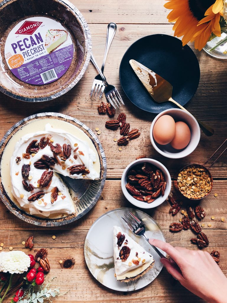 Table with Dark and Stormy Cream Pie and various cooking supplies.