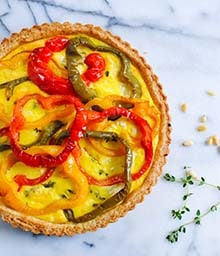 Top view Bell Pepper Quiche with Pine Nut Crust.