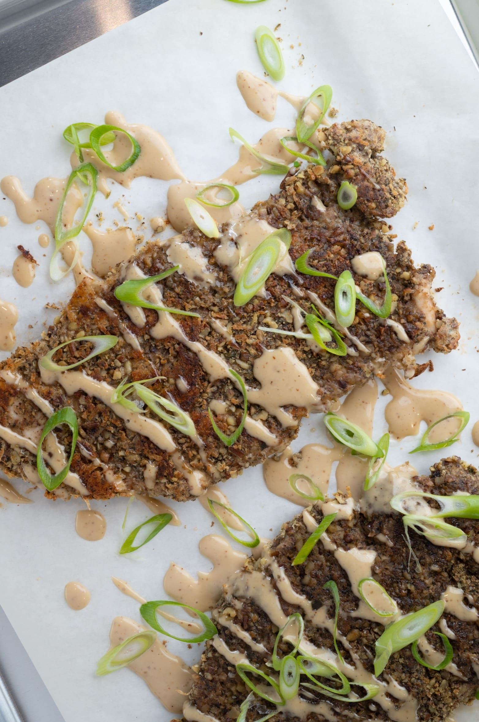 Artfully plated Ranch Crusted Chicken with Alabama Barbecue Sauce.