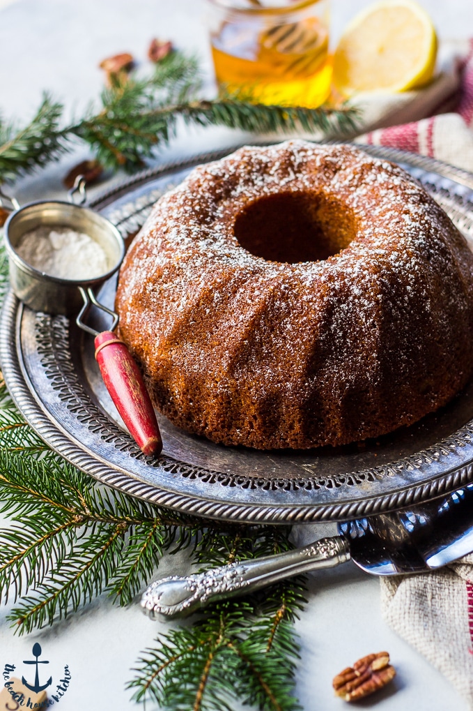 Honey Pecan Bundt Cake on a festively decorated table.