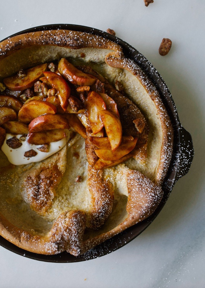 Cast iron pan with Pecan Apple Dutch Baby.