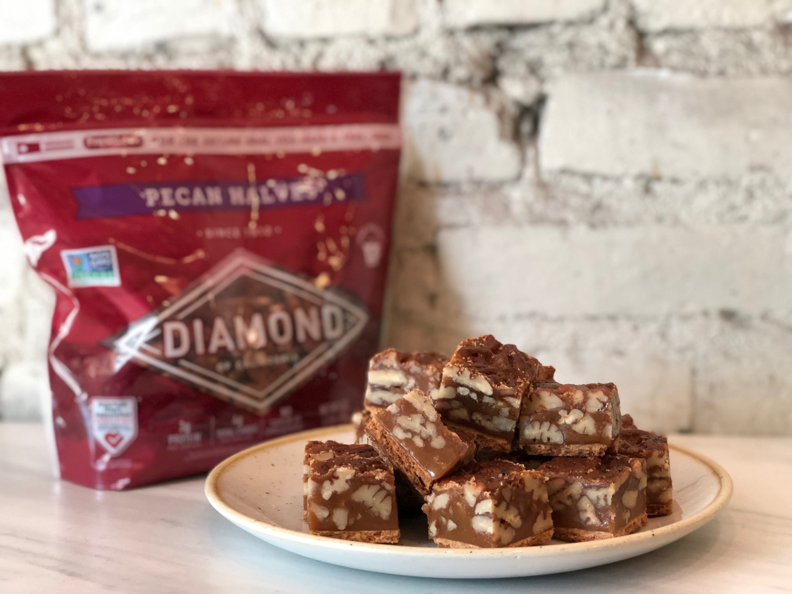 Plate of stacked Diamond of California Pecan Squares.