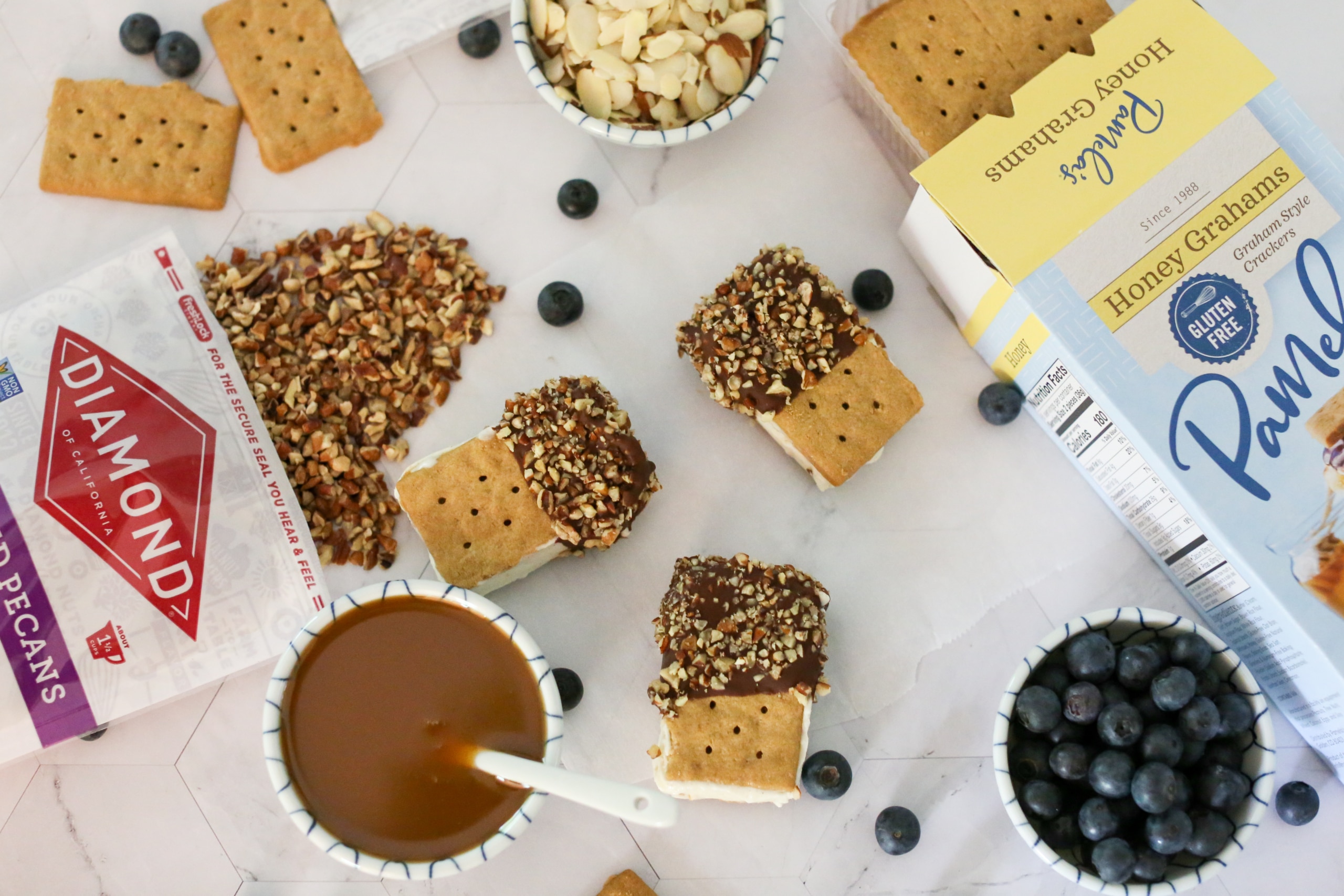 Chocolate and Nut Covered Ice Cream Sandwiches Made with Graham Crackers