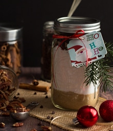 Mason jar gift layered with ingredients for Messy Baker Banana Bread.