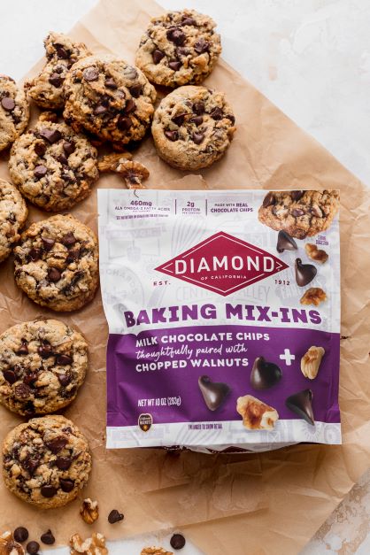 Bag of Diamond Nuts Baking Mix-Ins next to several Cowboy Cookies.