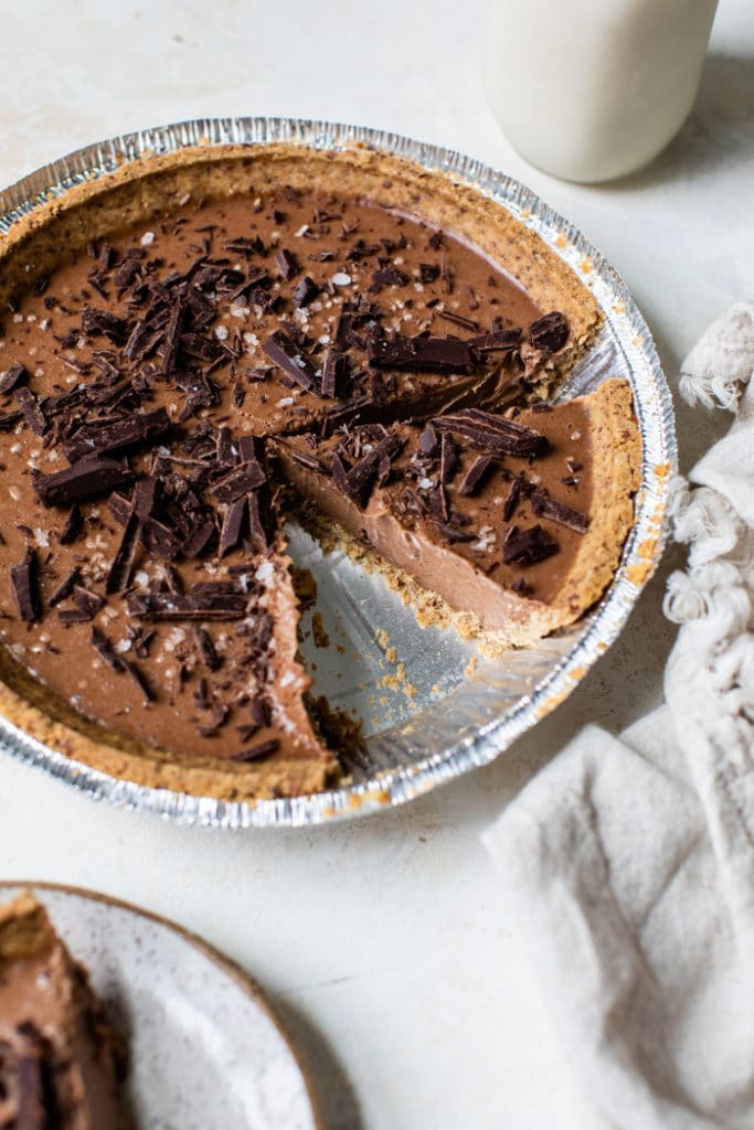 No-Bake Chocolate Pie with Walnut Pie Crust with a slice taken out.