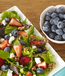 Plate of Red, White, and Blue Salad and bowl of blueberries.