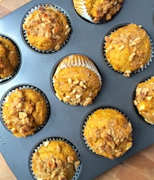 Muffin pan filled with baked Pumpkin Muffins.