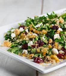 Plate with Toasted Walnut Kale Quinoa Salad.