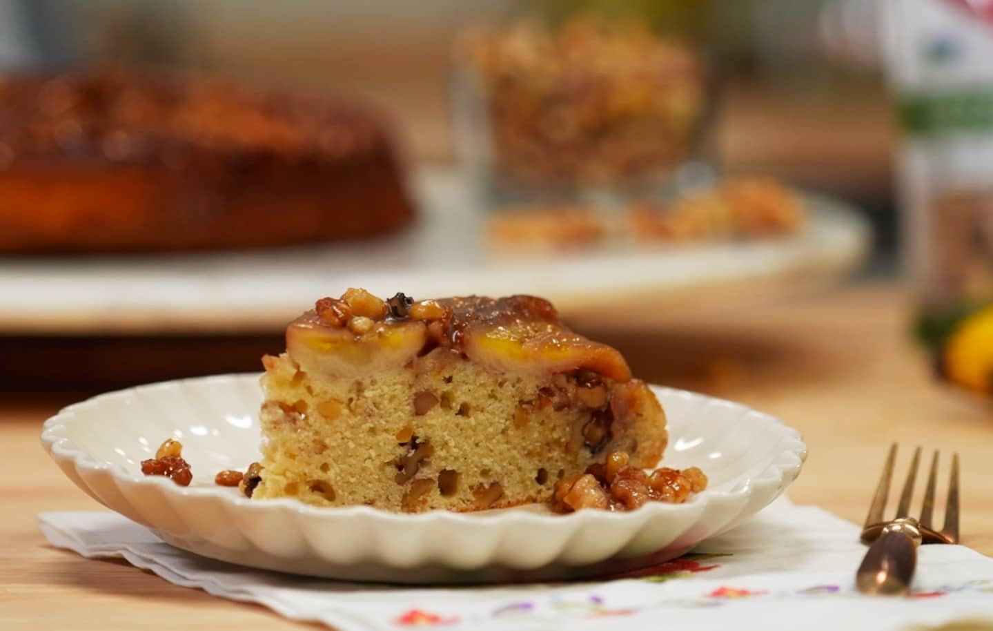 Slice of Walnut Banana Upside Down Cake on a plate.