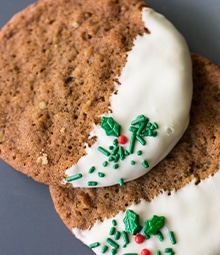 White Chocolate Pecan Gingersnaps dipped in white chocolate with festive sprinkles.