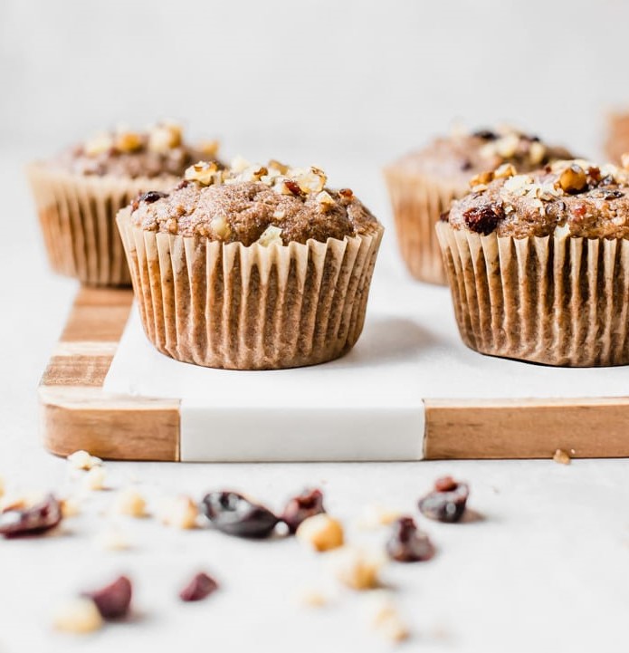 Whole Wheat Vegan Morning Glory Muffins on cutting board.