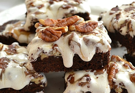 Pile of Marshmallow Brownies with chopped Diamond Nuts.