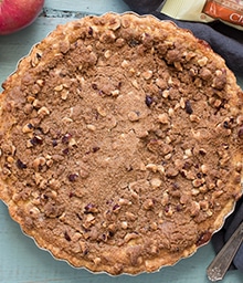 Top view Apple Custard Pie with Hazelnut Streusel.