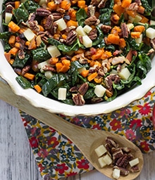 Big bowl of Kale Salad with Pecans, Sweet Potatoes, and Apples.