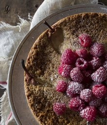 Pear and Walnut Cake topped with raspberries.