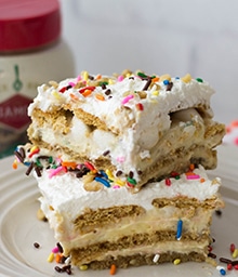 Two stacked squares of Birthday Cake No-Bake Lasagna.