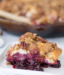 Serving of Blackberry Pecan Skillet Cobbler.