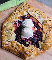 Top view Rustic Peach and Blackberry Tart a la mode.