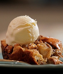 Plate of Banana Walnut Bread Pudding a la mode.