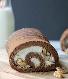 Chocolate Walnut Chiffon Swiss Roll on cutting board.