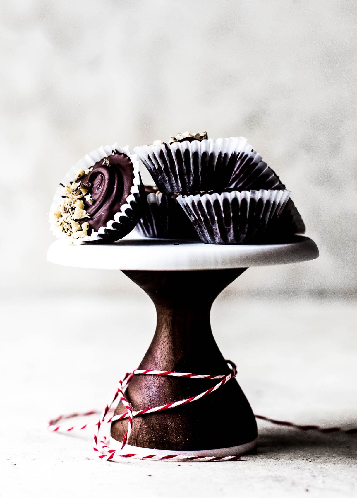 Decorative pedestal with Mini Walnut Caramel Chocolate Cups.