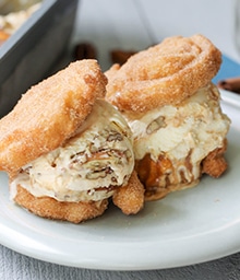 Two Churro Caramel Pecan Ice Cream Sandwiches.