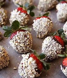 Chocolate covered strawberries dipped in crushed hazelnuts.