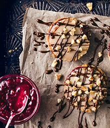 Dark Chocolate Walnut Raspberry Cookies drizzled with chocolate.