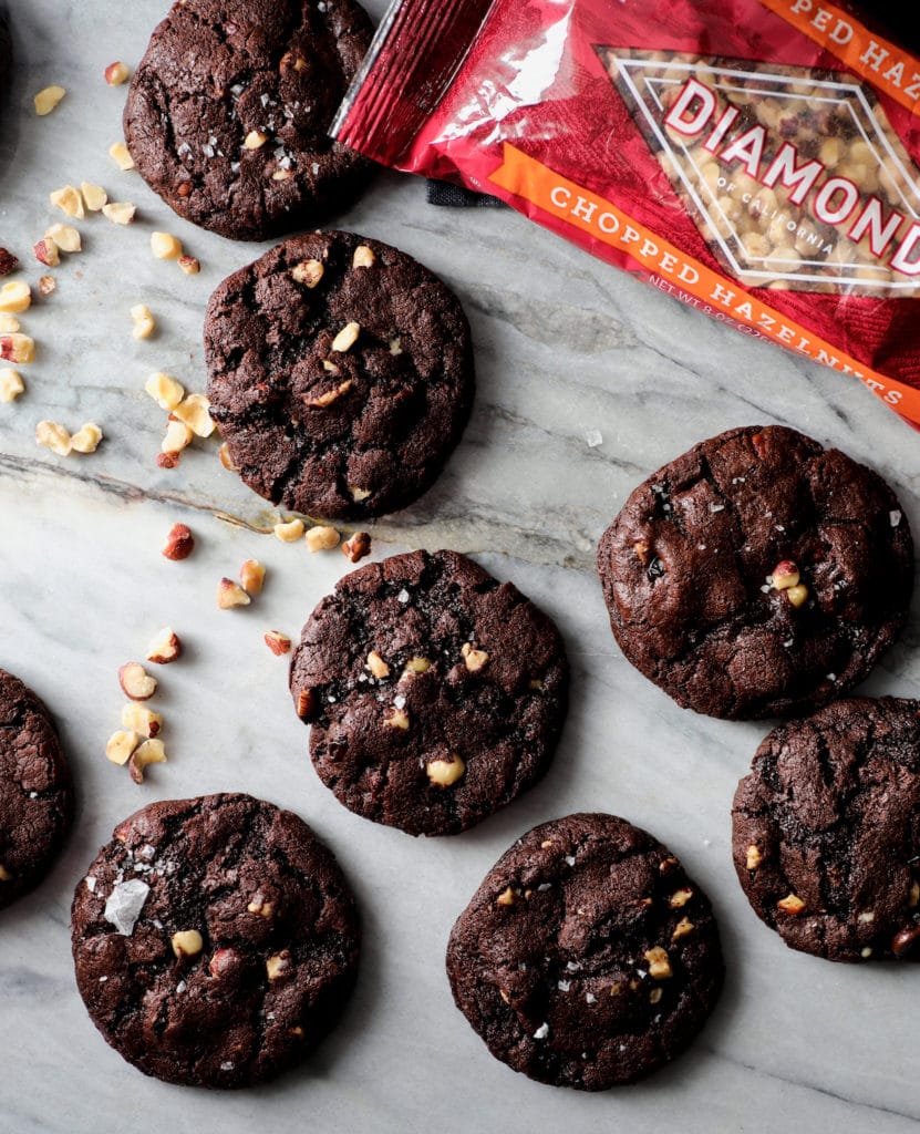 Dark Chocolate Hazelnut Truffle Cookies next to bag of Diamond hazelnuts.