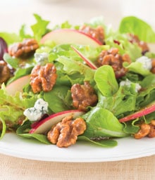 Green salad with glazed walnuts, apples, and blue cheese.