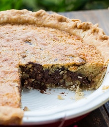 Kentucky Derby Chocolate Walnut Pie with piece taken out.