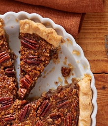 Maple Pecan Pie with slices taken out.
