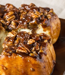 Two slices of Diamond Nuts Pecan Sticky Buns.