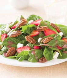 Spinach salad with strawberries, feta, and glazed pecans.