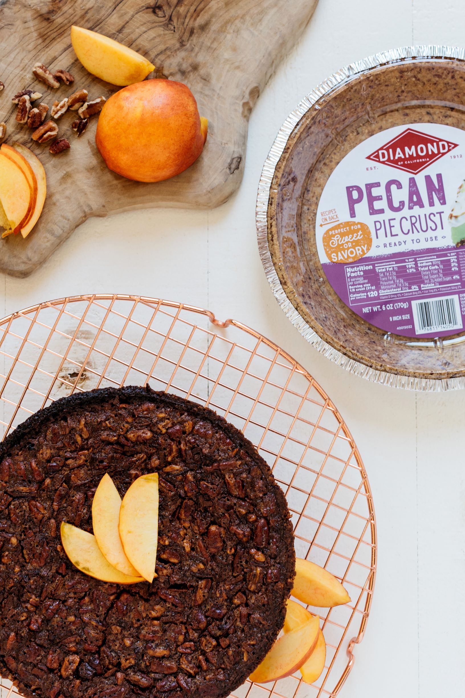 Coconut Pecan Pie on a cooling rack next to Diamond Pecan Pie Crust.