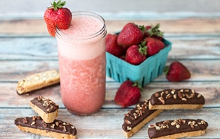 Strawberry Smoothie, pint of fresh strawberries, and Chocolate Dipped Almond Biscottis.