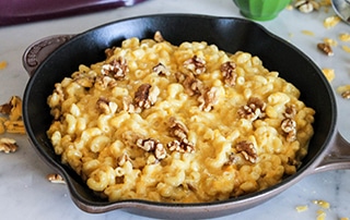Cast iron of Butternut Squash Mac and Cheese with Walnuts.