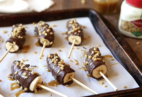 Chocolate Covered Frozen Bananas with Caramel and Walnuts