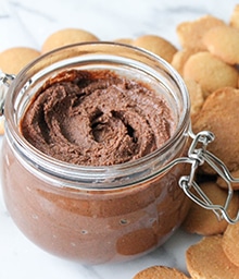 Jar of Chocolate Hazelnut Spread surrounded by wafer cookies.