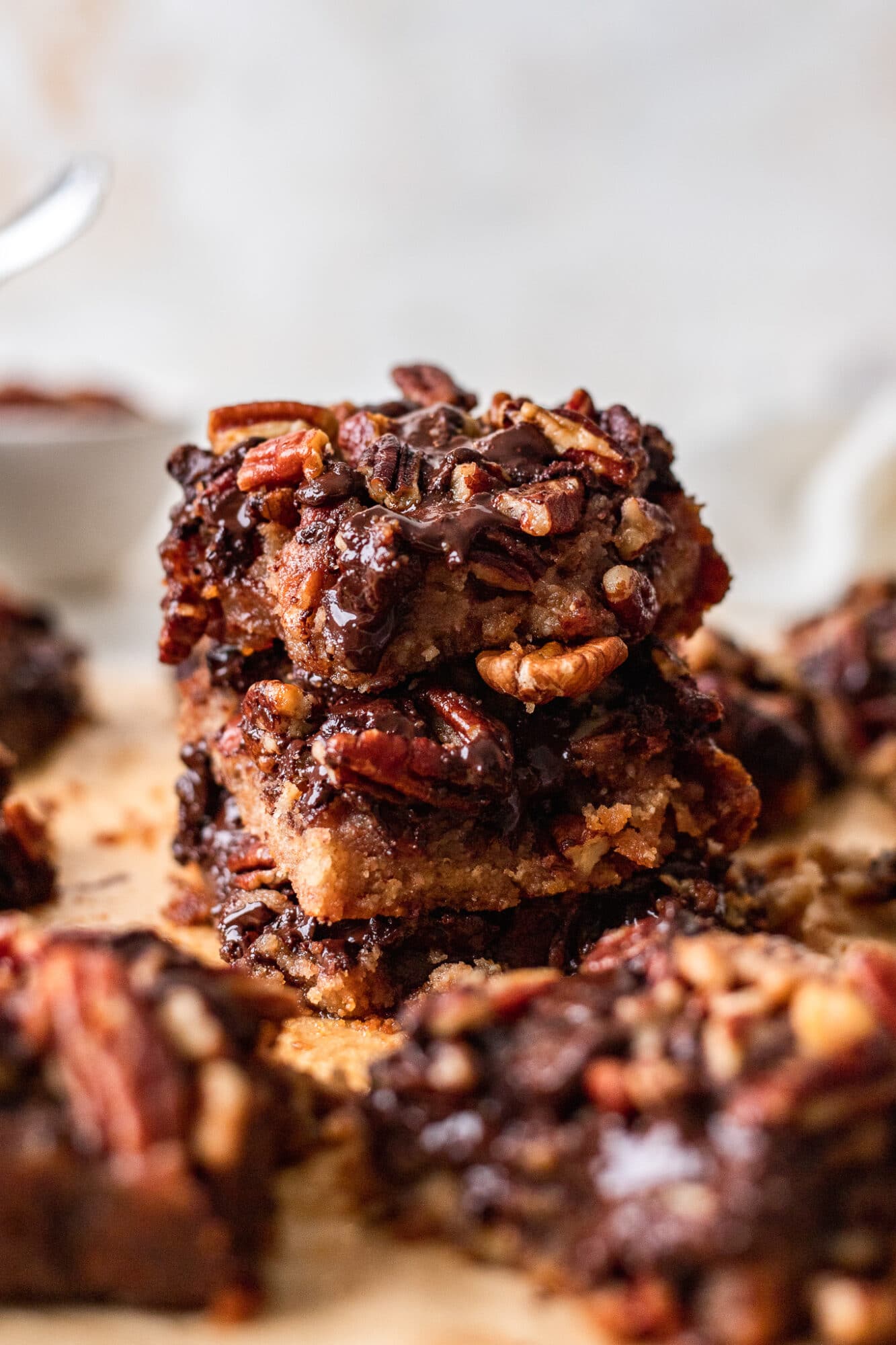 Stack of Vegan Chocolate Pecan Pie Bars.