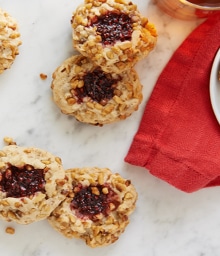 Walnut-Raspberry Linzer Thumbprint Cookies.